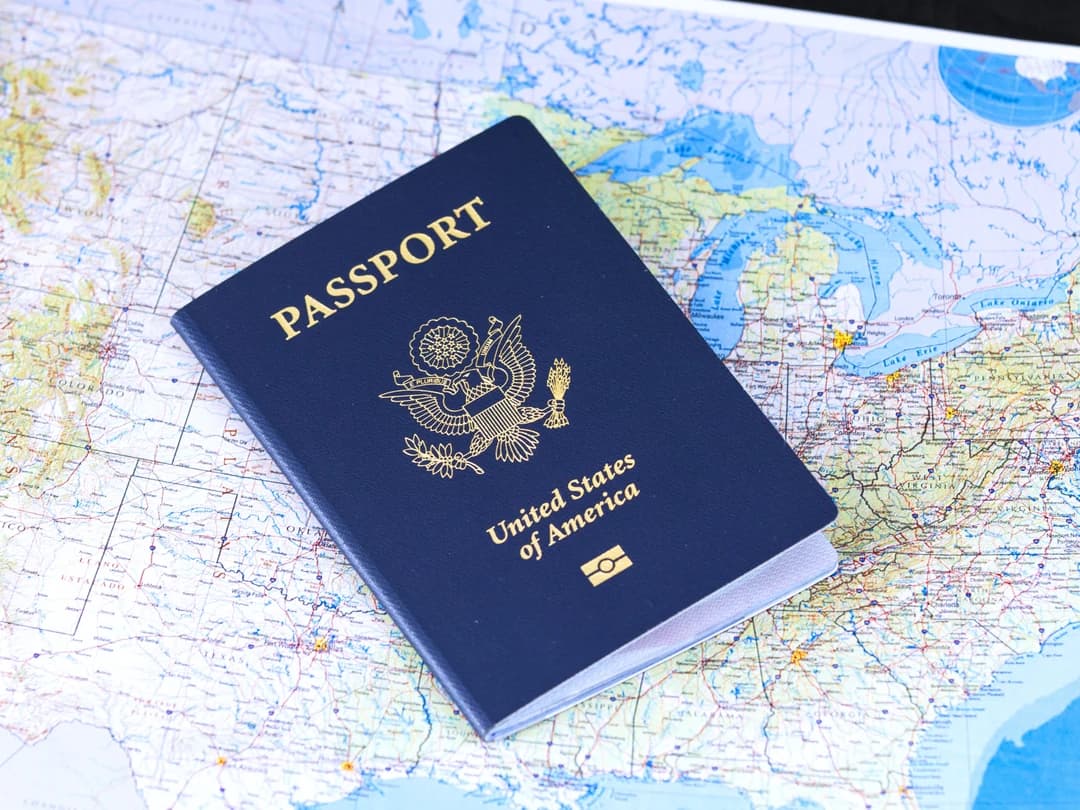 A passport lying on a world map